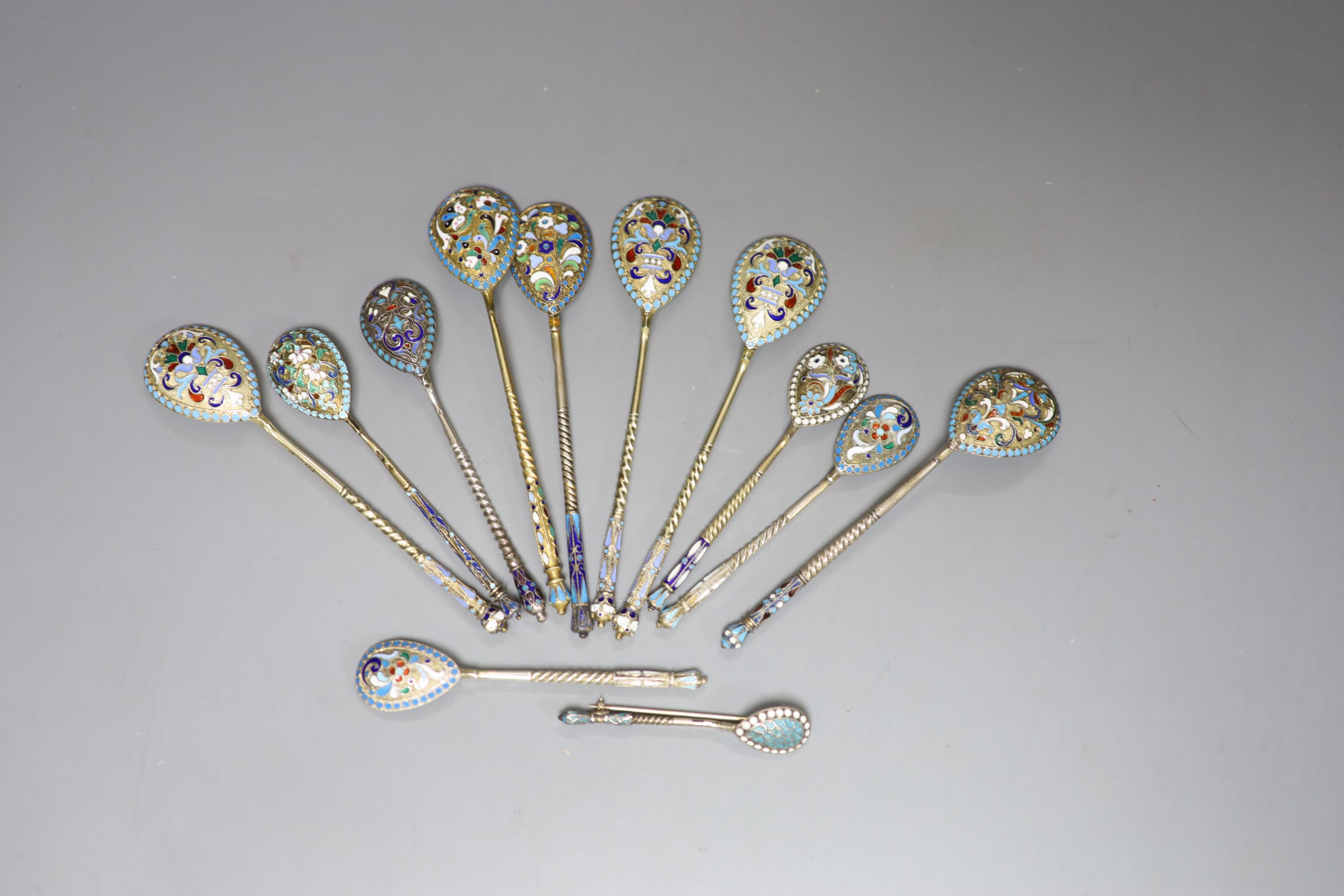 A small collection of twelve assorted late 19th/early 20th century Russian 84 zolotnik and cloisonne enamel teaspoons, etc